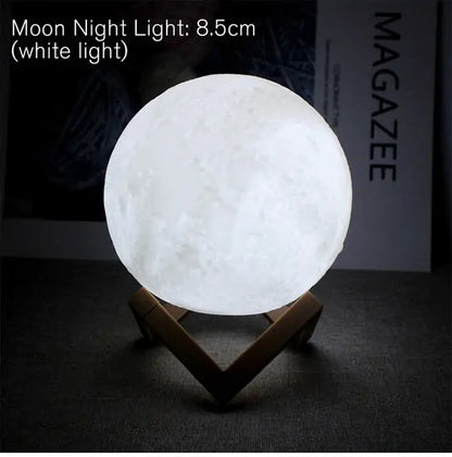 An LED battery moon lamp with a realistic lunar texture, placed on a wooden stand, emitting a soft white glow.